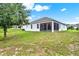 The backyard includes a screened-in patio, offering a great space for relaxation and entertaining at 804 Glen Creek Ct, Fruitland Park, FL 34731