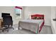 Bedroom with a large window offering natural light and an adjacent desk area for work or study at 804 Glen Creek Ct, Fruitland Park, FL 34731