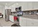 Modern kitchen with stainless steel appliances, granite countertops, and white cabinetry at 804 Glen Creek Ct, Fruitland Park, FL 34731