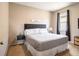 Bright bedroom with gray accents, carpeted floor, and natural light at 8710 Rindge Rd, Polk City, FL 33868
