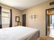 Bedroom with a carpeted floor, black accents, and multiple doors at 8710 Rindge Rd, Polk City, FL 33868