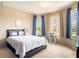 Bright bedroom featuring a comfortable bed, natural light and neutral colored walls at 8710 Rindge Rd, Polk City, FL 33868