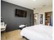 Bedroom with a TV, vanity, and access to a bathroom and closet at 8710 Rindge Rd, Polk City, FL 33868