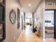 Inviting hallway featuring tile floors, stylish decor, and entry to the bedroom and living area at 8710 Rindge Rd, Polk City, FL 33868