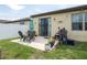 Covered patio area with furniture and a grill at 8710 Rindge Rd, Polk City, FL 33868