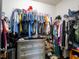 Image shows a walk-in closet with clothing racks, shelves for shoes, and a dresser at 8710 Rindge Rd, Polk City, FL 33868
