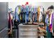 Walk-in closet featuring a dresser and hanging clothes at 8710 Rindge Rd, Polk City, FL 33868