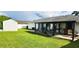 Lush backyard with a covered patio, perfect for outdoor entertaining and relaxation at 8767 Grandee Dr, Orlando, FL 32829
