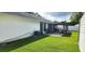 Spacious backyard featuring a covered patio area, ideal for outdoor relaxation and entertaining at 8767 Grandee Dr, Orlando, FL 32829