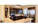 Modern kitchen with stainless steel appliances, dark wood cabinets, and granite countertops at 8767 Grandee Dr, Orlando, FL 32829