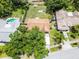 Birds-eye view showing the home's backyard, patio and proximity to neighbors at 891 Licaria Dr, Ocoee, FL 34761