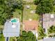 Aerial view of property with backyard, hot tub, and convenient storage shed at 891 Licaria Dr, Ocoee, FL 34761