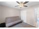 Bedroom featuring carpet floors, ceiling fan, closet space and lots of natural light at 891 Licaria Dr, Ocoee, FL 34761