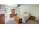 Bedroom featuring carpet floors, ceiling fan and a chest at the foot of the bed at 891 Licaria Dr, Ocoee, FL 34761