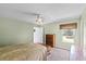 Bedroom featuring carpet floors, ceiling fan and a window with natural light at 891 Licaria Dr, Ocoee, FL 34761