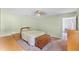 Bedroom featuring carpet floors, ceiling fan and a chest at the foot of the bed at 891 Licaria Dr, Ocoee, FL 34761