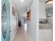 Bright entryway featuring tiled floors, fresh blue walls, and an open view to the kitchen and living areas at 891 Licaria Dr, Ocoee, FL 34761