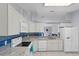 Updated kitchen showcasing stainless steel appliances and stylish blue backsplash at 891 Licaria Dr, Ocoee, FL 34761