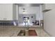 Granite countertops highlight this open kitchen with sink, and views into the living area at 891 Licaria Dr, Ocoee, FL 34761