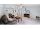 Spacious living room with ample seating, a TV, and open access to other areas at 891 Licaria Dr, Ocoee, FL 34761
