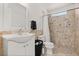 Bathroom features a stone tiled shower at 8920 Palisades Beach Ave, Orlando, FL 32829