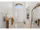 Bright foyer featuring tile flooring, a front door with sidelights, and a glimpse into other living spaces at 8920 Palisades Beach Ave, Orlando, FL 32829