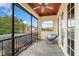 Comfortable balcony with tile flooring, ceiling fan, and scenic views at 9253 Tibet Pointe Cir, Windermere, FL 34786