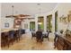 Cozy dining area with coffered ceilings adjacent to the breakfast bar and living room at 9253 Tibet Pointe Cir, Windermere, FL 34786
