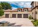 Spacious three-car garage with brick-paved driveway and Mediterranean-style architecture at 9253 Tibet Pointe Cir, Windermere, FL 34786