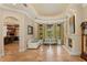 Inviting living room featuring a fireplace, tile flooring, and bay windows with a view at 9253 Tibet Pointe Cir, Windermere, FL 34786