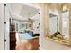 Opulent bedroom with wood floors, luxurious furniture, and balcony access for relaxing outdoor moments at 9253 Tibet Pointe Cir, Windermere, FL 34786