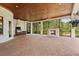 Expansive outdoor living space features a fireplace, built-in grill, and beautiful brick flooring at 9253 Tibet Pointe Cir, Windermere, FL 34786
