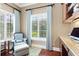 Cozy sitting room featuring natural light from windows and light blue curtains at 9253 Tibet Pointe Cir, Windermere, FL 34786