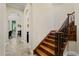 Elegant staircase with wood steps and decorative iron railing at 9253 Tibet Pointe Cir, Windermere, FL 34786