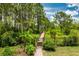 Wooded path with gated access, adding a touch of nature to the backyard at 9253 Tibet Pointe Cir, Windermere, FL 34786