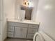 Bathroom with vanity, mirror, modern lighting, and a view of a shower at 947 Bird Bay Ct # 205, Lake Mary, FL 32746