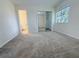 Bedroom with carpeting, closet with mirrored doors, and an ensuite bathroom at 947 Bird Bay Ct # 205, Lake Mary, FL 32746