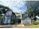 Attractive condo building with large windows, stairs to the entrance and landscaping at 947 Bird Bay Ct # 205, Lake Mary, FL 32746