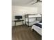 Bedroom with bunkbeds, a tv on a desk, and a full size bed at 970 N Spring Garden Ave # 621, Deland, FL 32720
