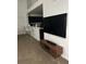View of the living room featuring a wall mounted TV and modern TV stand at 970 N Spring Garden Ave # 621, Deland, FL 32720