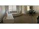 Spacious living room showcasing a comfortable sectional sofa, dining set, and washer/dryer at 970 N Spring Garden Ave # 621, Deland, FL 32720