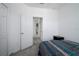 Neutral bedroom featuring carpeted floors, a closet and access to the rest of the home at 978 E 10Th St, Apopka, FL 32703