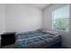Bright bedroom with large window, closet, and bed at 978 E 10Th St, Apopka, FL 32703