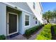 Entrance to the home with manicured greenery at 978 E 10Th St, Apopka, FL 32703