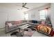 Bright living room with large sectional sofa, decorative pillows, modern décor, and natural light at 978 E 10Th St, Apopka, FL 32703