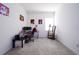 Office/flex space with a window, carpet floors, and room for furniture at 978 E 10Th St, Apopka, FL 32703