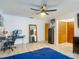 Spacious bedroom featuring wood-look floors, a ceiling fan, and a computer desk at 1129 Madura Dr, Deltona, FL 32725