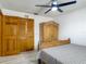 A well-organized bedroom features wood furniture, closet space and plenty of light, making it feel open at 1129 Madura Dr, Deltona, FL 32725