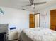 Well-lit bedroom showing a chair, closet, and decor that creates a relaxing atmosphere at 1129 Madura Dr, Deltona, FL 32725