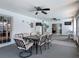 Inviting sunroom featuring an outdoor dining area, ceiling fans, and great natural light at 1129 Madura Dr, Deltona, FL 32725